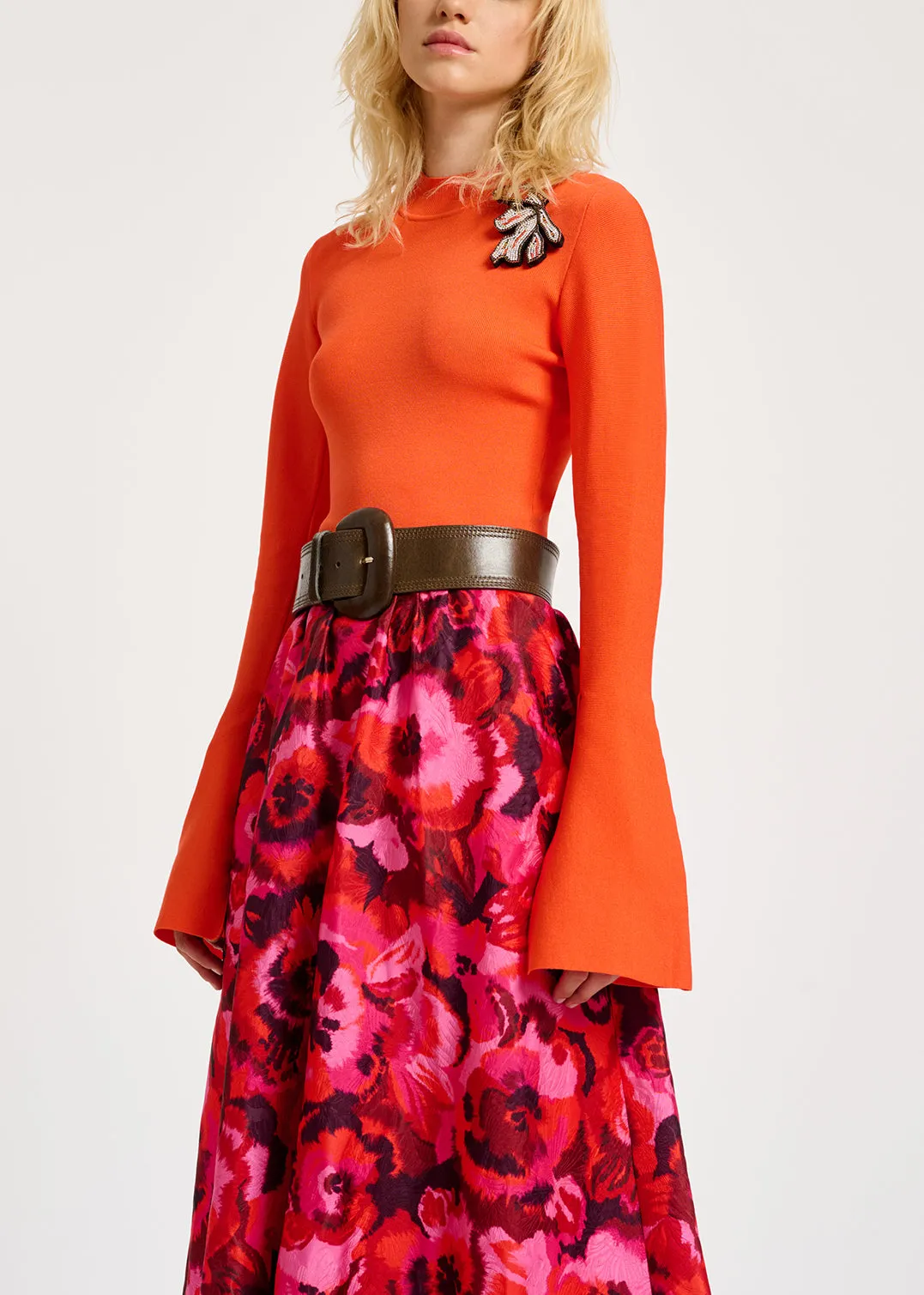 Orange slim-fit knit sweater with trumpet sleeves