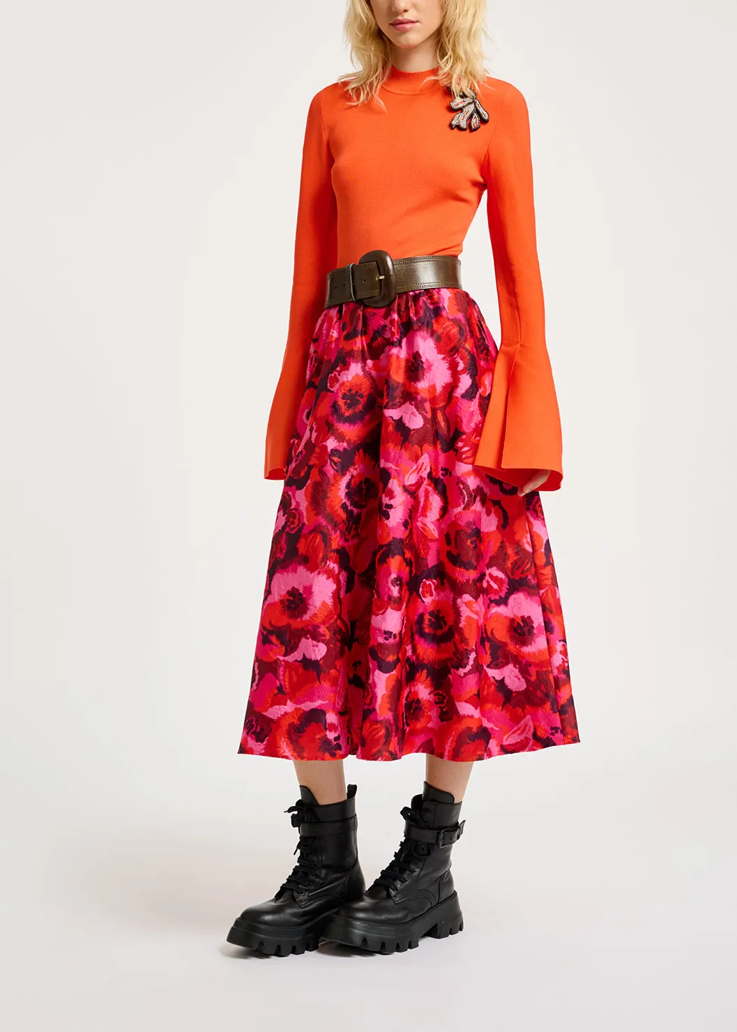 Orange slim-fit knit sweater with trumpet sleeves