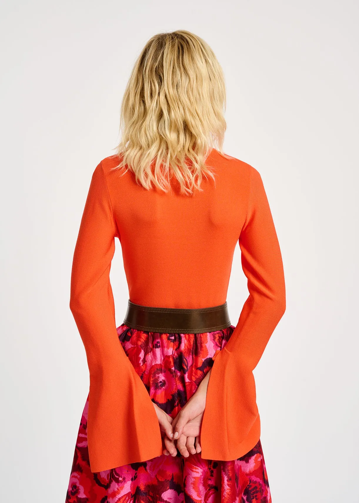 Orange slim-fit knit sweater with trumpet sleeves