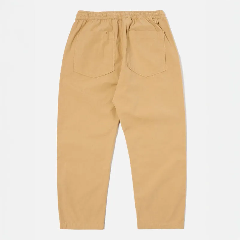 UNIVERSAL WORKS Hi Water Trousers in Dark Sand